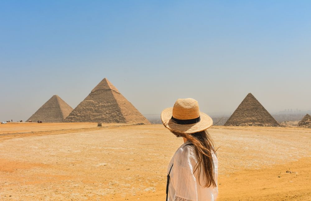 Tourist and Egyptian pyramids 